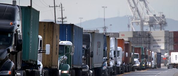 Diesel-powered freight trucks idling at Port of Oakland (Photo by Justin Sullivan via Getty Images)