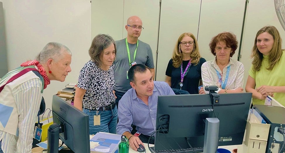 EDF’s Global Clean Air team examines local air quality management data with local government partners in Brazil. Photo by Sergio Sanchez.